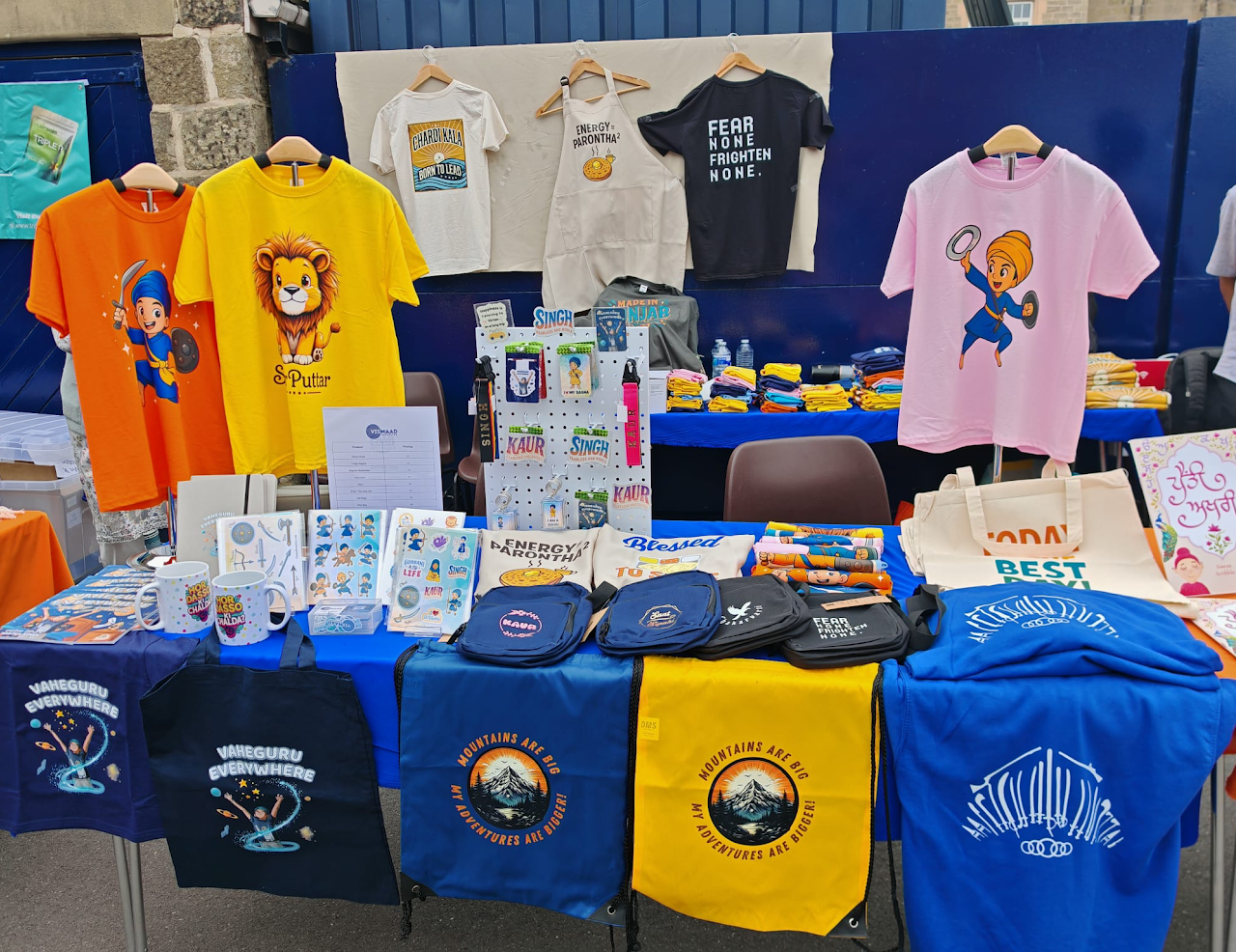 Vismaad Creatives stall setup with apparel, gifts, and accessories on display